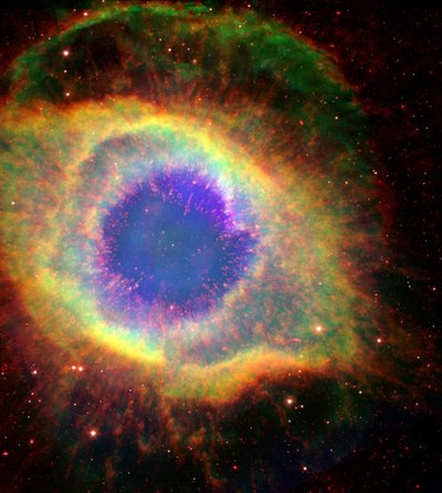 The Helix Nebula (NGC 7293), sometimes called The Eye of God, a large planetary nebula in the constellation Aquarius by National Aeronautics and Space Administration National Aeronautics and Space Administration